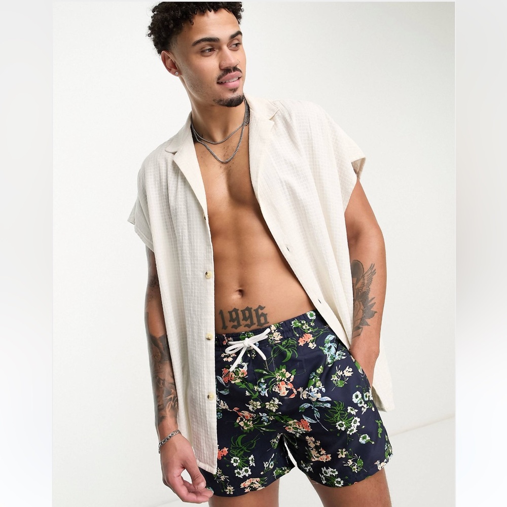 Mens swim shorts in navy floral print